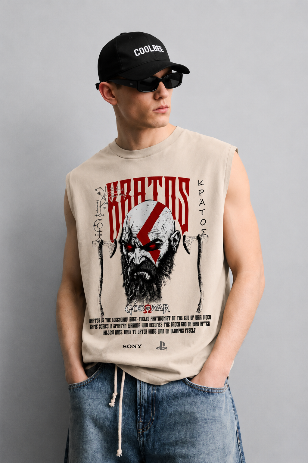 Beige tank top with a muscular warrior character illustration in a dark mythological battle scene framed by gaming-console-style logo accents.