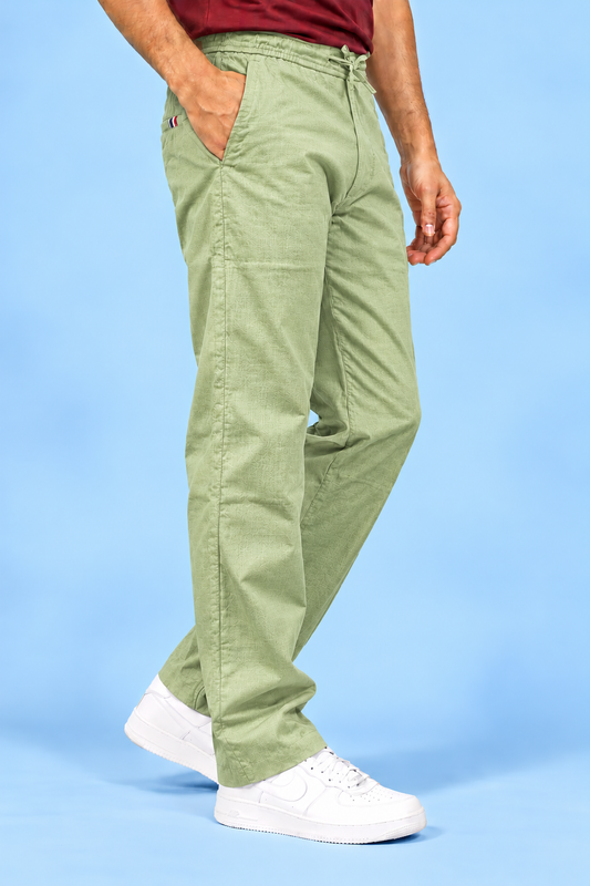 Cool Bee Linen Travel Pants Sea Green – side view mid-stride, sea green linen travel pants