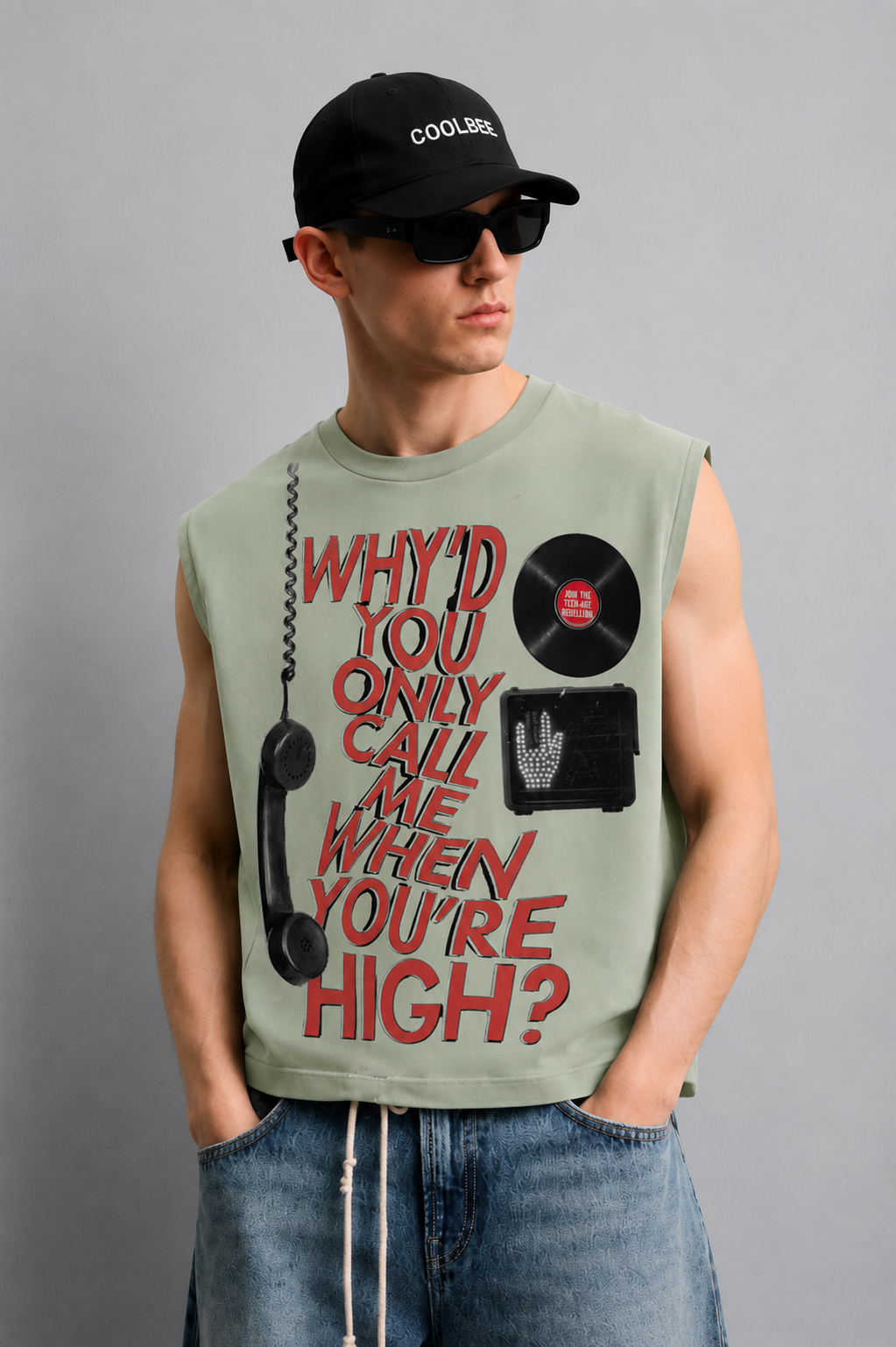 Sage green tank top with a retro telephone illustration and bold vintage-style lettering across the chest.