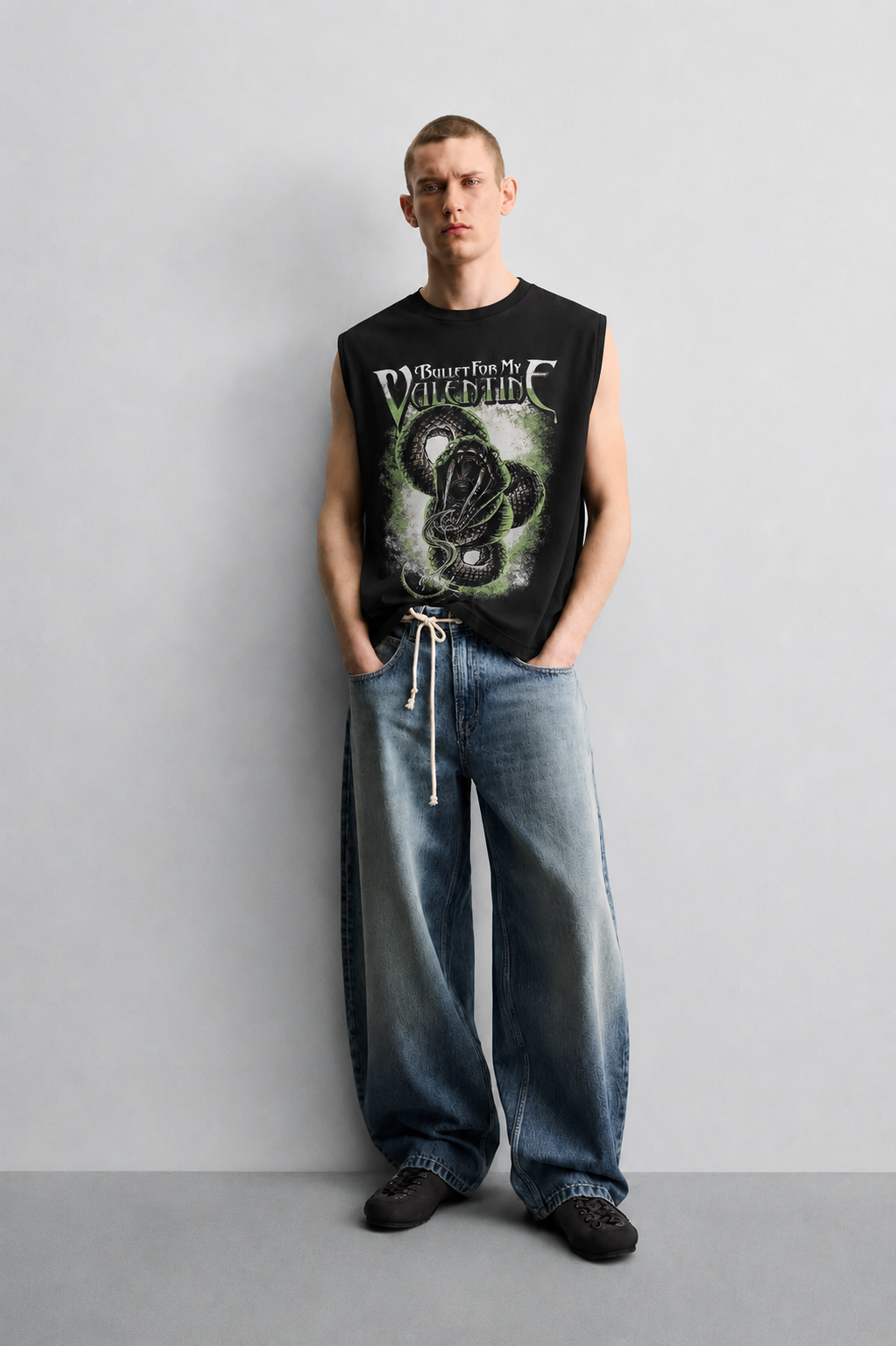 Black tank top with a coiled snake-and-heart illustration in a dark romantic-horror style accented by dripping red lettering.
