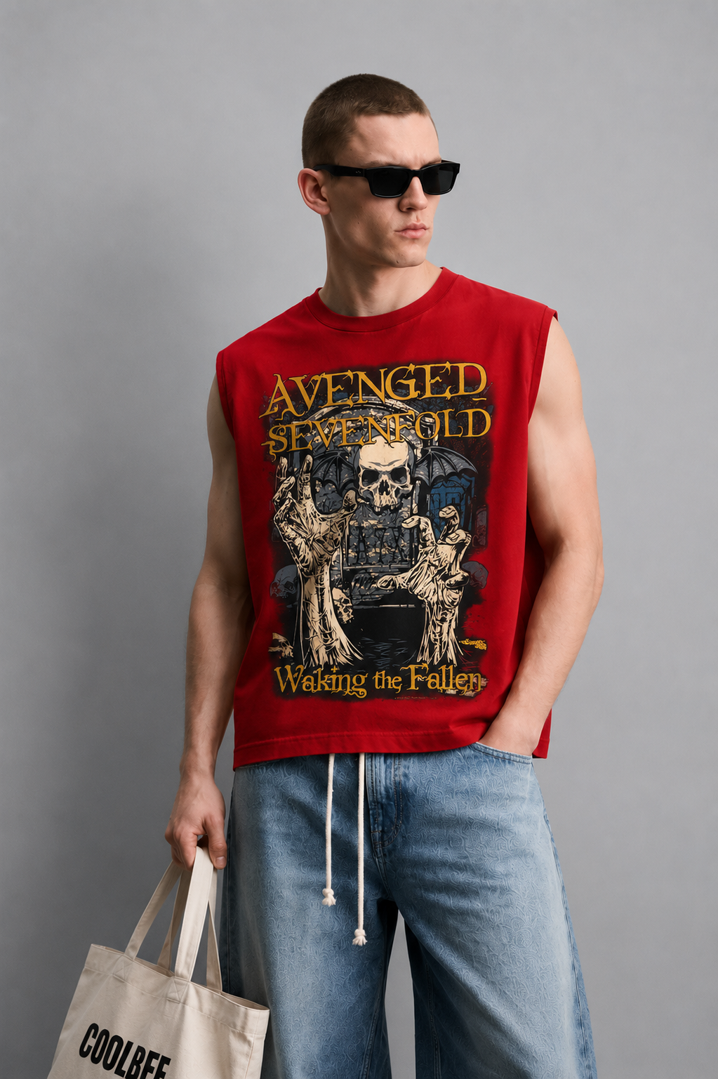Red tank top with a distressed winged-skull graphic and bold gothic lettering in a horror-rock poster style.