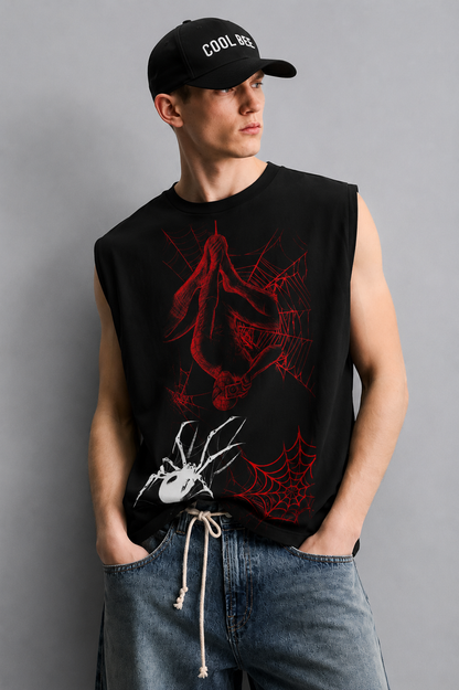 Black tank top with a red-lined illustration of a masked superhero figure hanging upside down in a web, alongside a white spider graphic and red spiderweb accents.