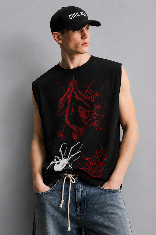 Black tank top with a red-lined illustration of a masked superhero figure hanging upside down in a web, alongside a white spider graphic and red spiderweb accents.