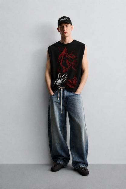 Black tank top with a red-lined illustration of a masked superhero figure hanging upside down in a web, alongside a white spider graphic and red spiderweb accents.
