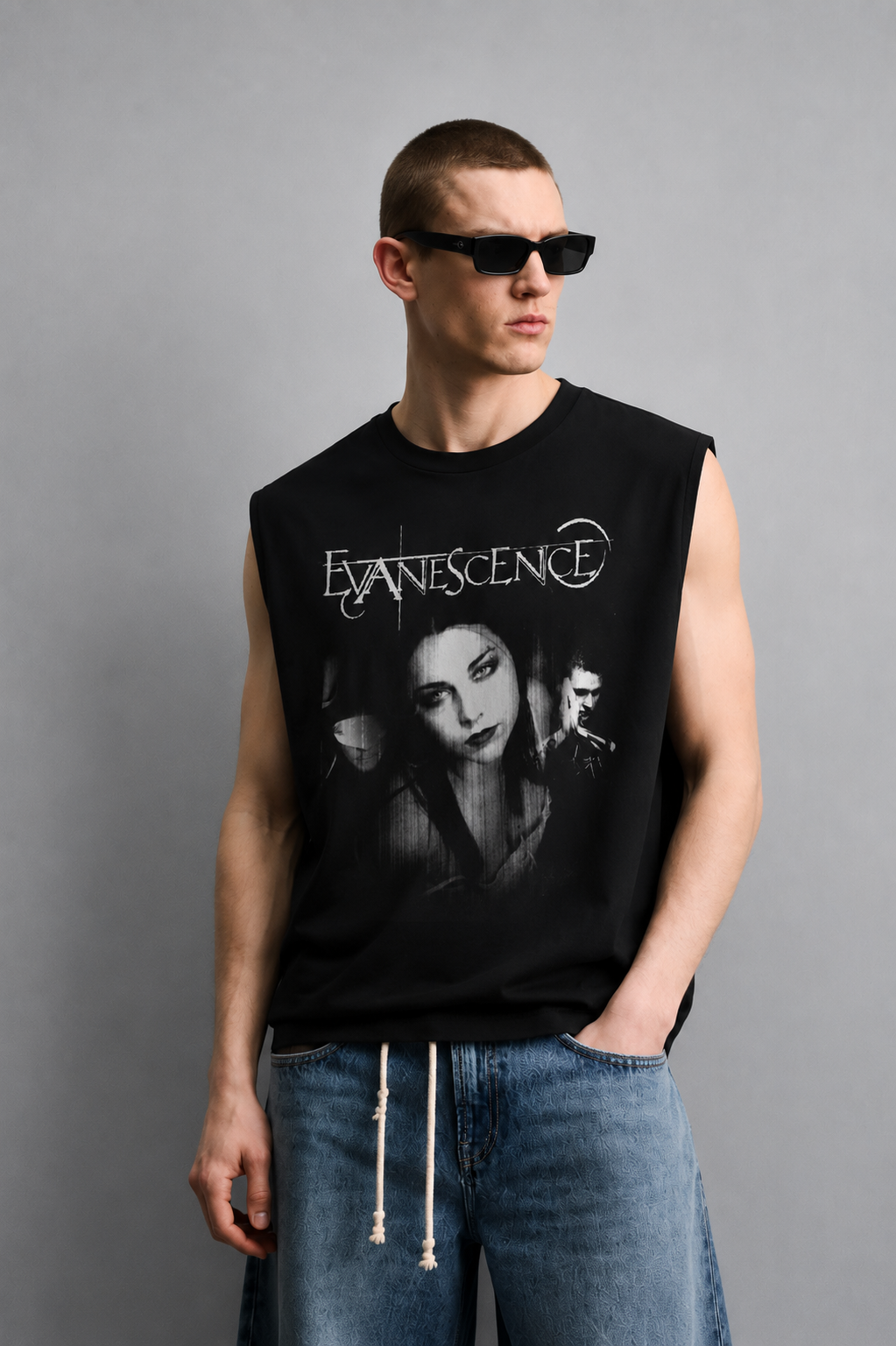 Black tank top with bold distressed band-style lettering above a black-and-white photo collage of three musicians.