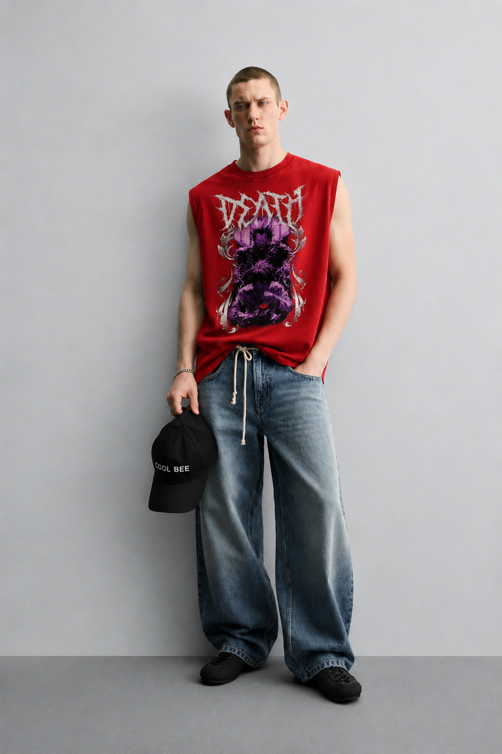 Red tank top with bold jagged 'Death' lettering above a purple-toned illustration of a demonic figure with clawed hands and a glowing red eye.