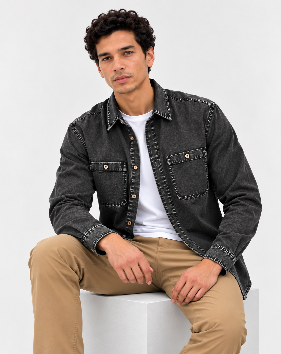 Cool Bee Urban Charcoal Denim Overshirt – model seated, charcoal denim shirt layered over white tee