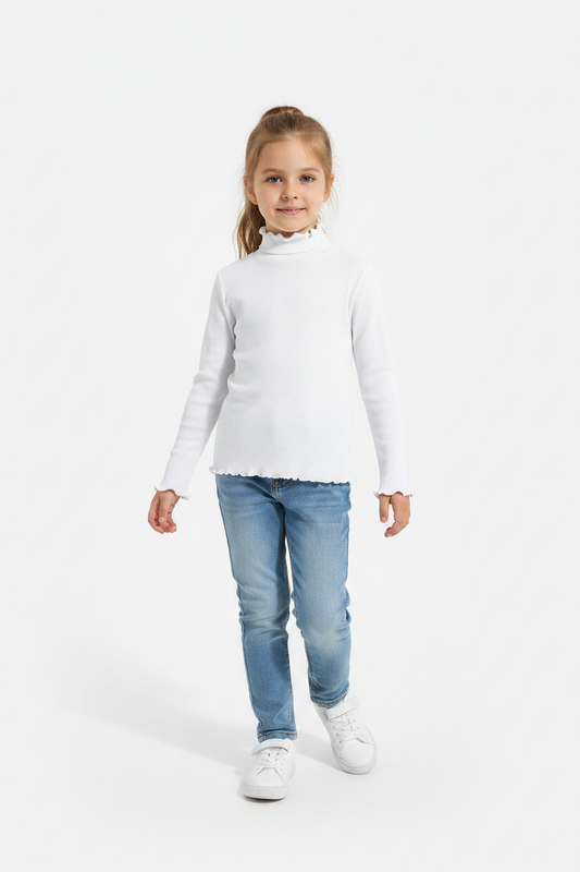 Girl in studio wearing white turtleneck