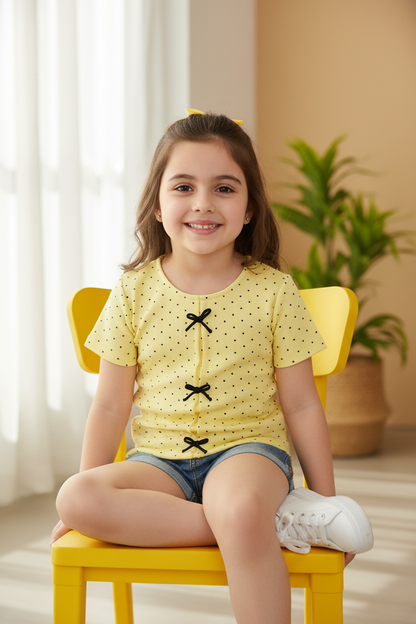 Coolbee Store – Girl on sunny chair wearing yellow polka dot bow top