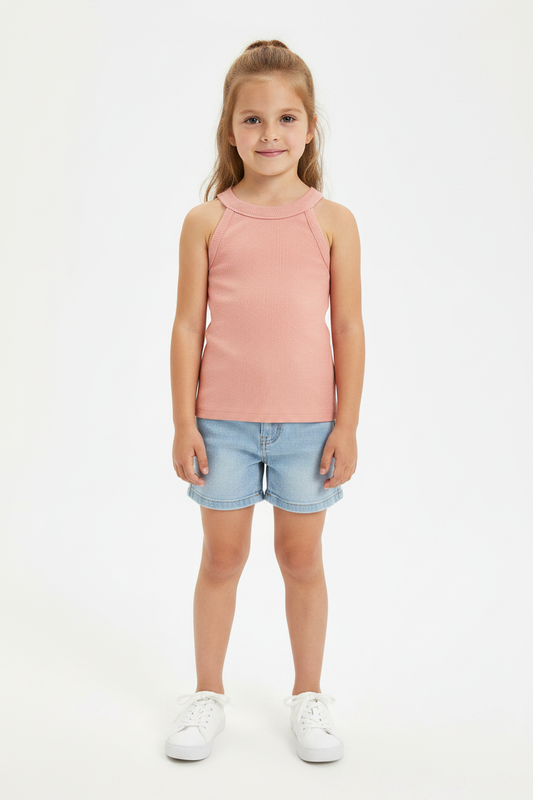 Girl on white background wearing pink ribbed sleeveless top