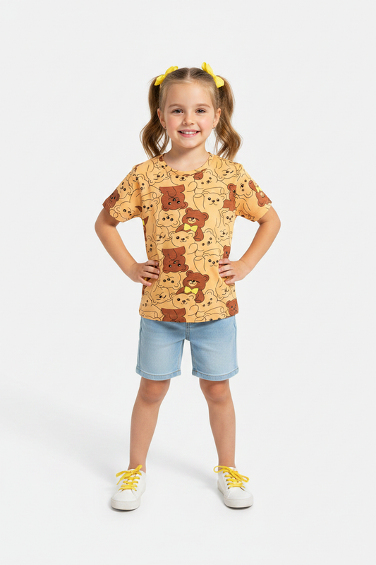 Girl on white background wearing yellow teddy bear tee