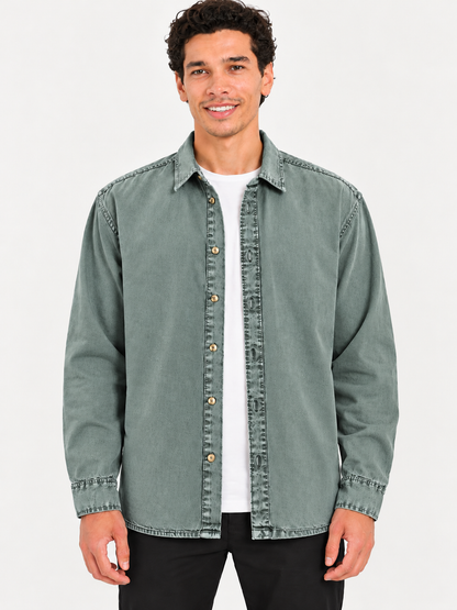 Cool Bee Sage Heritage Washed Denim Shirt – front view, sage green shirt worn open over white tee with black trousers