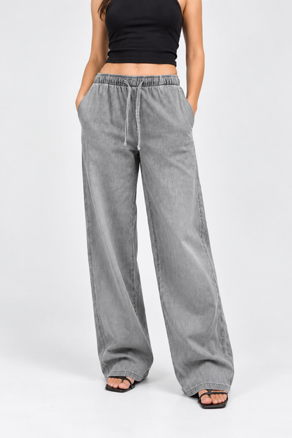 Cool Bee Cotton Denim Wide Leg Joggers in Grey - front view with both hands in pockets