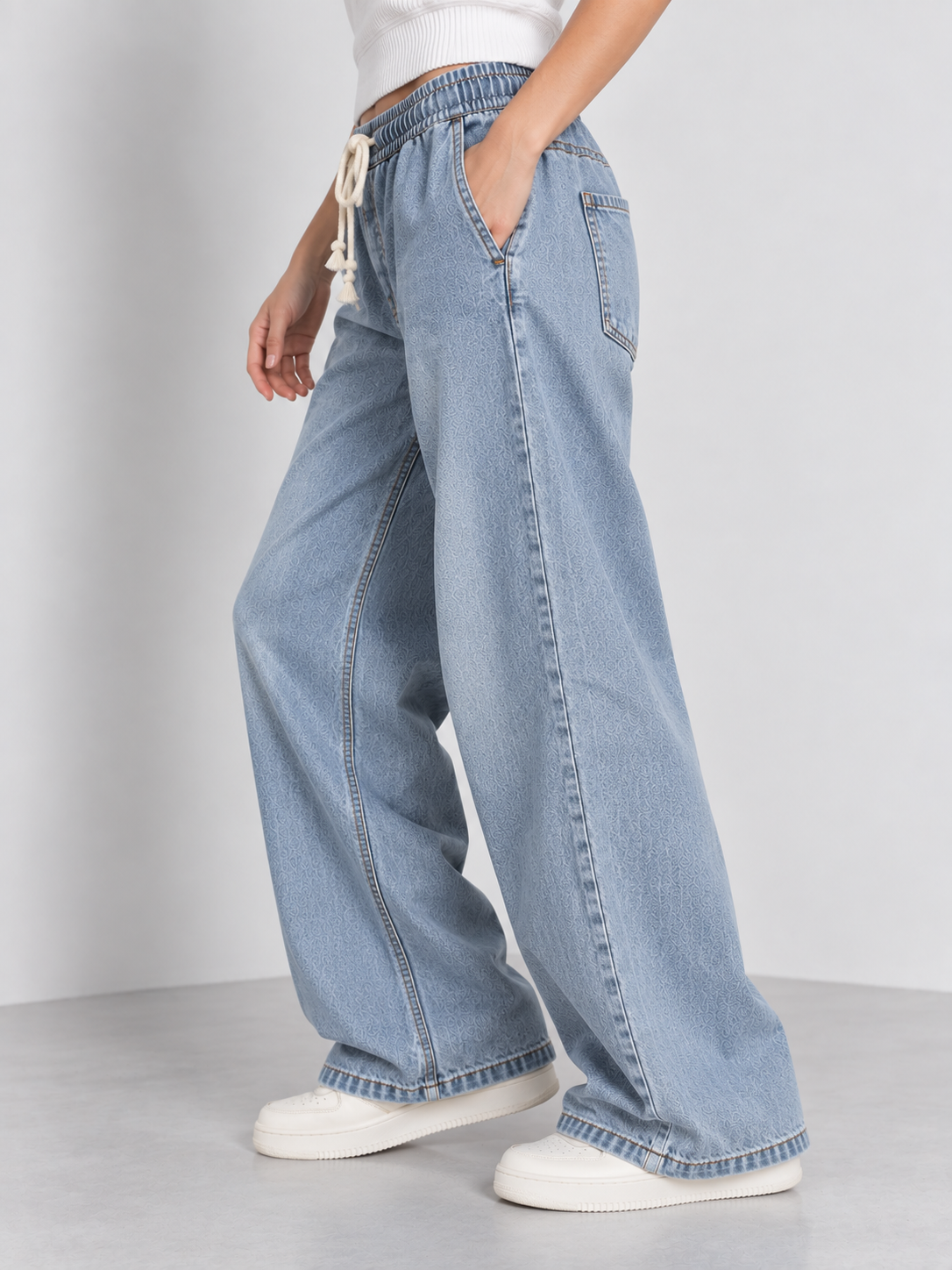 Cool Bee Cotton Denim Wide Leg Joggers in Blue - side angle view with hand in pocket