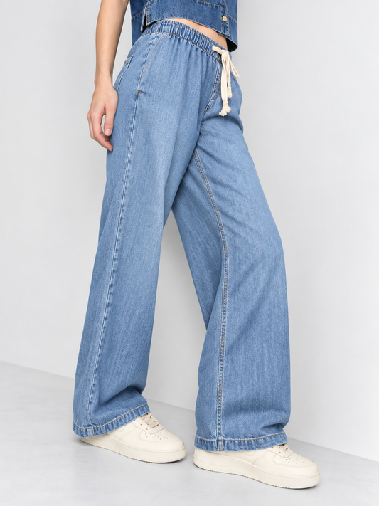 Cool Bee Cotton Denim Wide Leg Joggers in Mid Blue - close-up side view of drawstring waist